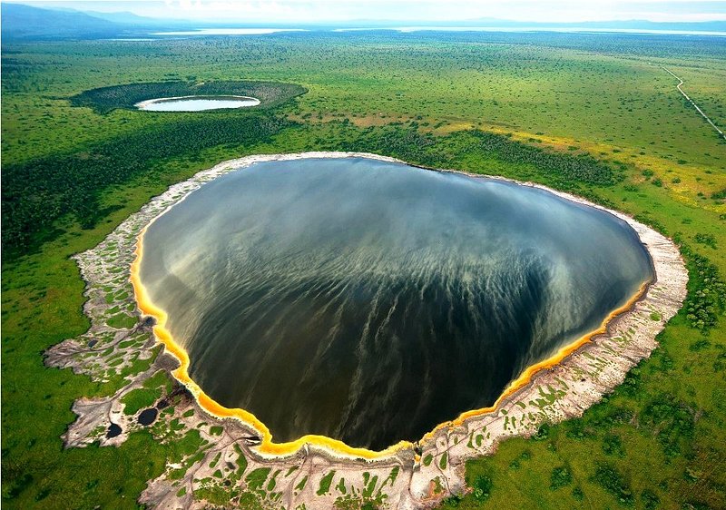 Aerial view of explosion crater lake in Queen Elizabeth National Park Uganda